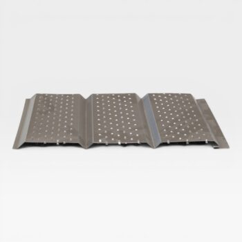metal soffit with perforations lying flat on table