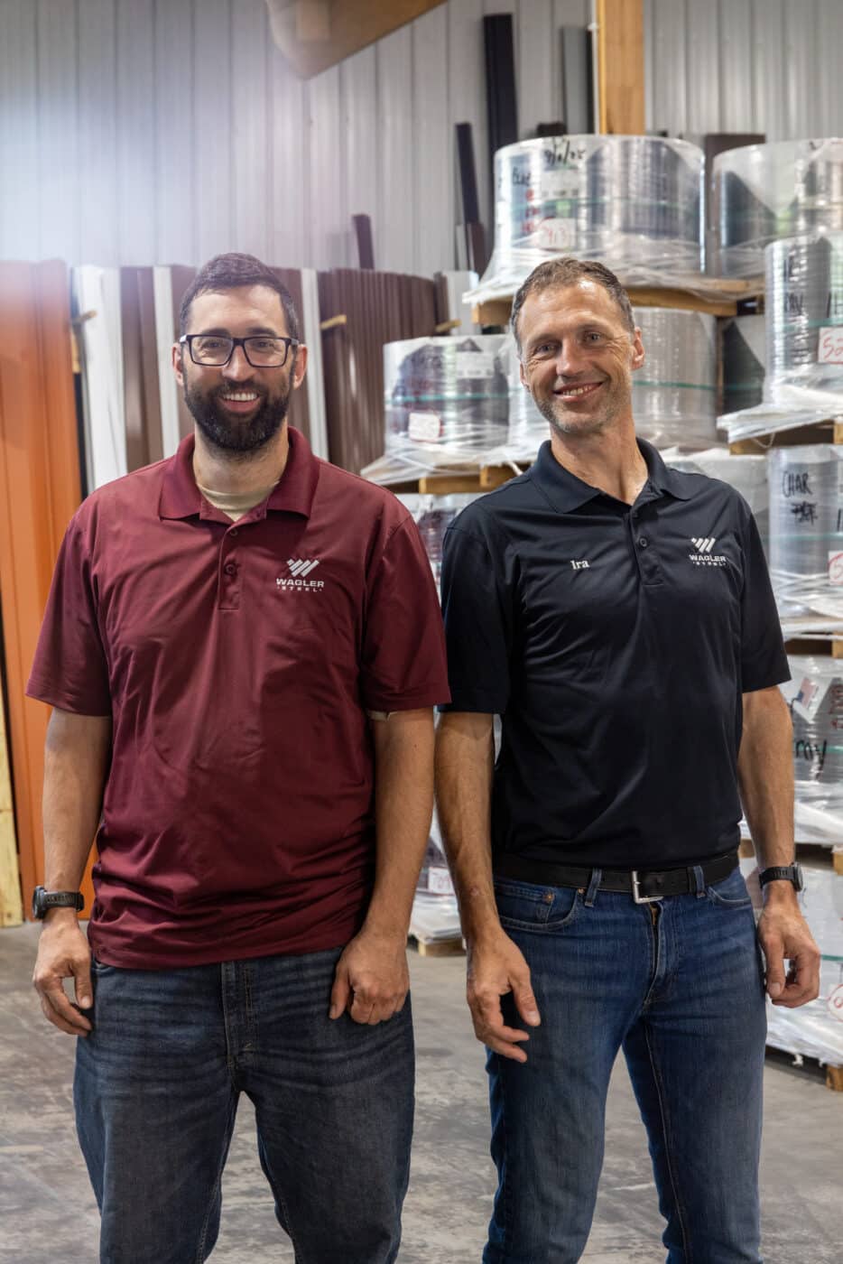 owners cliff and ira wagler standing near metal coils at wagler steel in paradise, pa