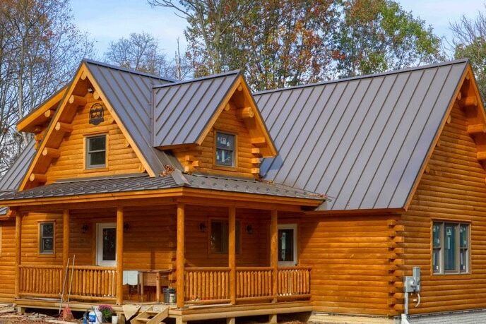 Dark gray Standing Seam panel metal roofing on a log cabin in Delaware near Wilmington