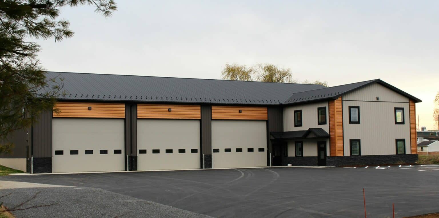 shop with black metal textured roofing charcoal and ash gray textured siding and copper metallic accent siding in paradies pa