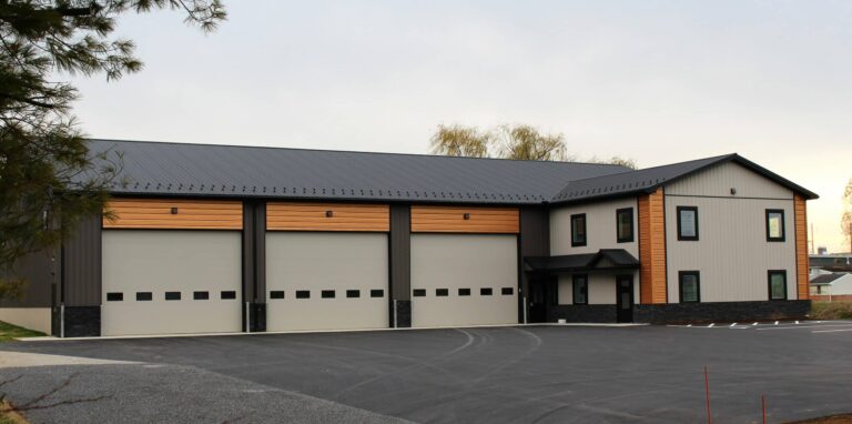 shop with black metal textured roofing charcoal and ash gray textured siding and copper metallic accent siding in paradies pa
