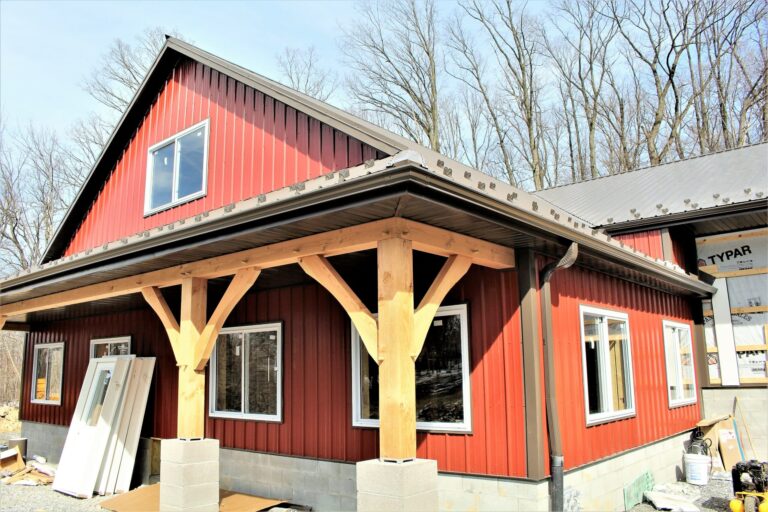 a ground-view photo of a home with metal siding installed and supplied by Wagler Steel