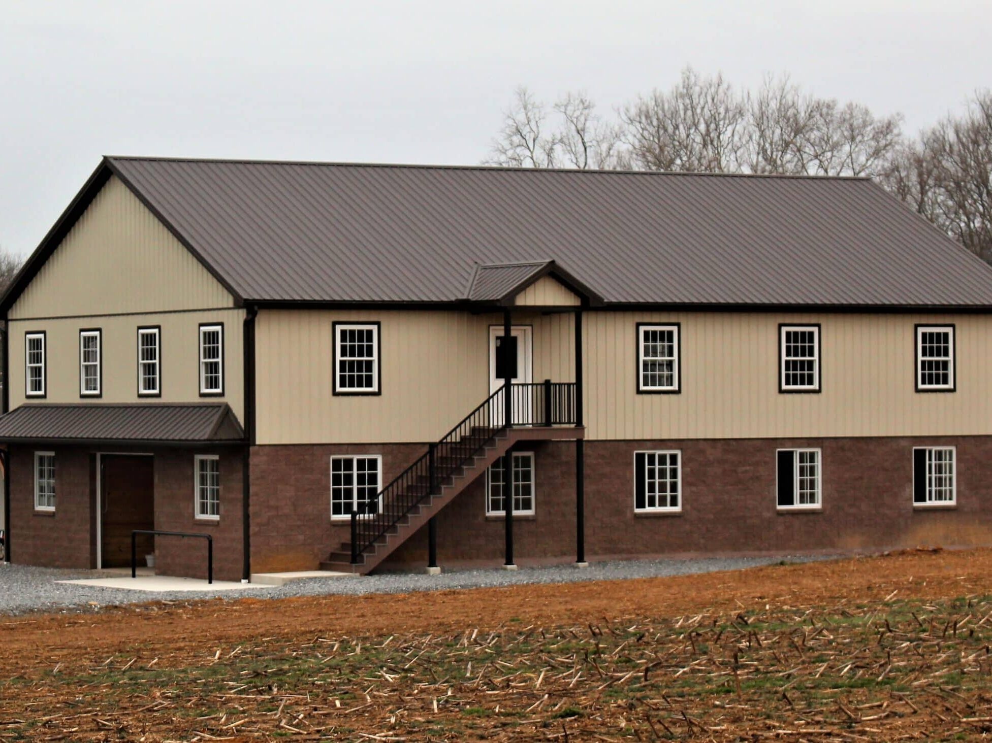 barn with light stone metal siding and burnished slate roofing and siding in leola pa